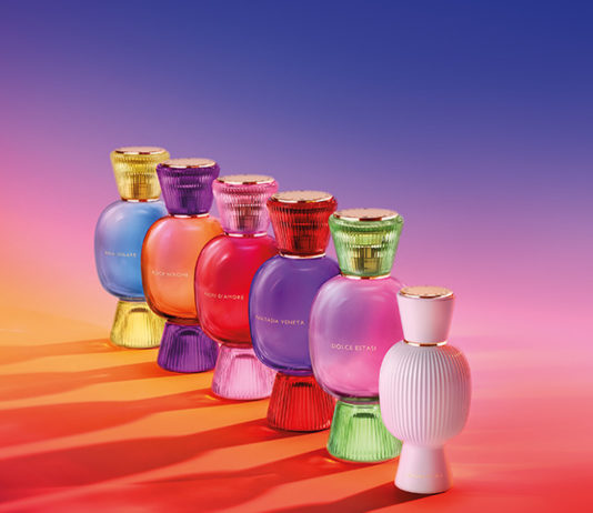 site-industries-cosmetiques 一排彩色香水瓶，外观像宝石。