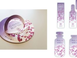 site-industries-cosmetiques 一个粉红色的瓶子，里面装着一朵粉红色的花。