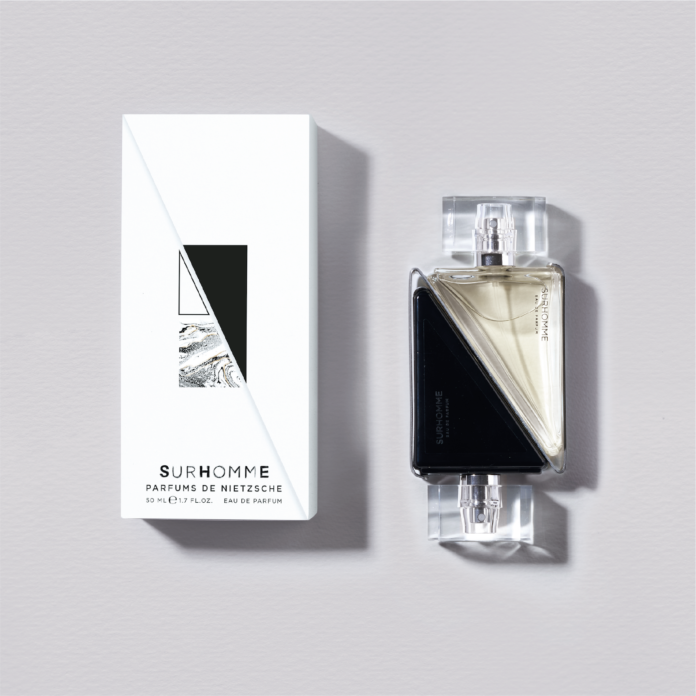 site-industries-cosmetiques A perfume bottle with a black box next to it, in partnership with Laurent Assoulen's first perfume brand.