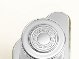 site-industries-cosmetiques A perfume bottle on a white surface.