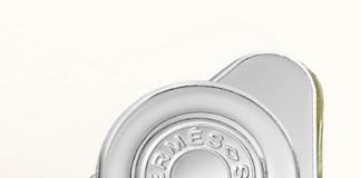 site-industries-cosmetiques A perfume bottle on a white surface.
