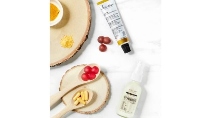 site-industries-cosmetiques Skin care products on a table with a spoon and a bottle.