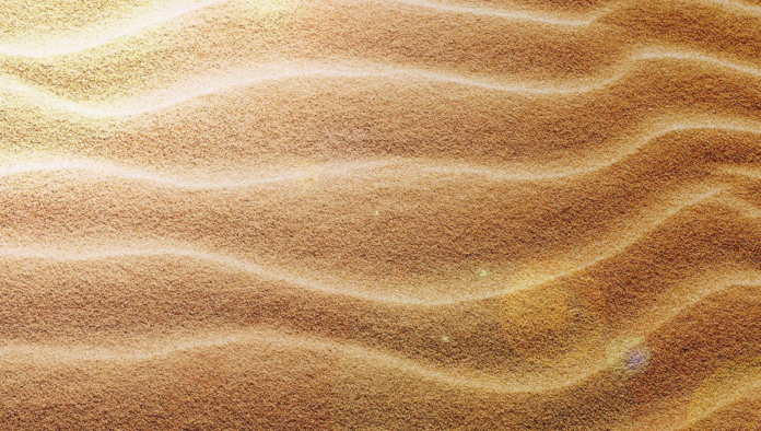 site-industries-cosmetiques Una duna de arena con olas que potencian el bronceado.