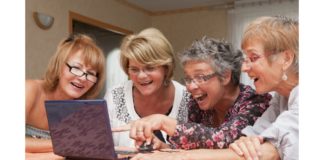 site-industries-cosmetiques A group of elderly women examining a laptop computer while considering hormonal evolution in women for cosmetics.