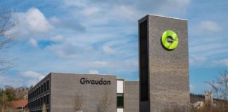 site-industries-cosmetics 一幢前面有绿色标志的建筑已被 Givaudan 收购。