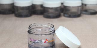 site-industries-cosmetiques Transparent jars, lids and tables.