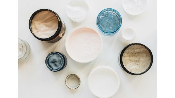 site-industries-cosmetiques Different types of skin care products on a white surface.