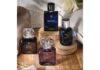 site-industries-cosmetiques Three bottles of perfume on a wooden table.