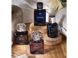 site-industries-cosmetiques Trois bouteilles de parfum sur une table en bois.