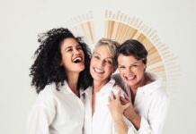 site-industries-cosmetiques Three women pose for a photo in front of a white background.