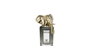 site-industries-cosmetiques Une bouteille en or avec un éléphant dessus - une bouteille en or, un éléphant.
