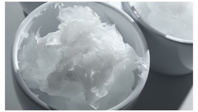 site-industries-cosmetiques A bowl of white powder in a white bowl, certified La Naturelyn 500 B.