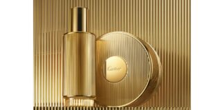 site-industries-cosmetiques Un flacon de parfum doré et un récipient rond assorti sont placés sur un fond doré nervuré. Le flacon, qui ressemble par son élégance à un Brouillon auto, présente une forme cylindrique avec une finition lisse, tandis que le contenant affiche bien en évidence le nom de la marque « Cartier » au centre de son couvercle.