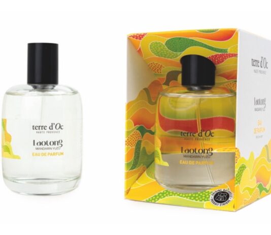 site-industries-cosmetiques 卢龙 "terre d'Oc "淡香水瓶的图片，其包装色彩艳丽，采用黄色、绿色和橙色的抽象图案，充满活力。环保设计的瓶身和包装盒上都自豪地标明 "法国制造"。