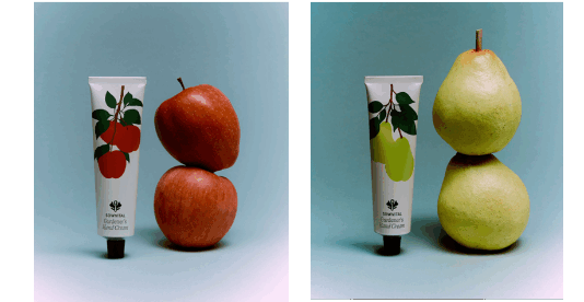 site-industries-cosmetiques Four side-by-side photos feature Sowvital hand creams alongside stacked figs, apples, pears and tomatoes. Each tube features a matching fruit illustration on a light blue background.