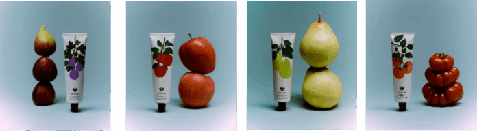 site-industries-cosmetiques Four side-by-side photos feature Sowvital hand creams alongside stacked figs, apples, pears and tomatoes. Each tube features a matching fruit illustration on a light blue background.