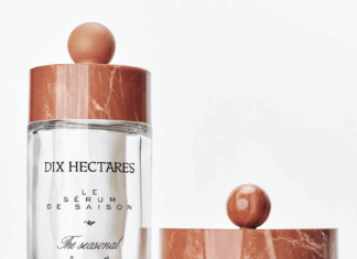 site-industries-cosmetiques Two glass containers of Dix Hectares skincare products are displayed on a white surface. One is a large bottle of serum and the other a small jar of cream. Both have marble-patterned lids and black text labels.