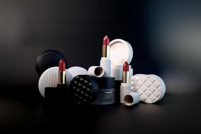 site-industries-cosmetiques 三支红色尖端的口红垂直摆放在各种黑白相间的圆形容器和盖子中，所有容器和盖子都摆放在深色背景的深色表面上。.