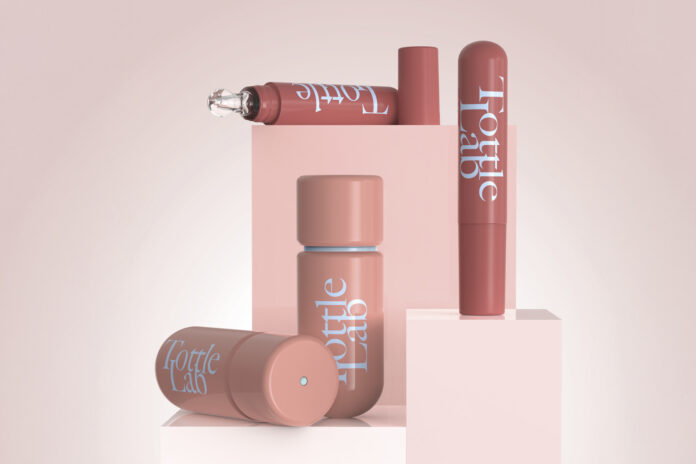 site-industries-cosmetiques 四个粉红色的化妆品瓶，上面刻着 