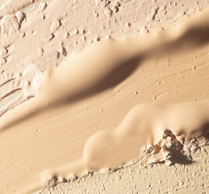 cosmetics-industry-website A close-up of several shades of beige and light brown from MPlus Cosmetics« »Essence Nude” foundation, applied and blended to create textured, uneven layers—a preview of the trends at the MakeUp in Paris 2026 trade show.