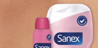 Sanex launches Derma Menopause, a skincare routine focused on the skin and hot flashes site-industries-cosmetiques Three Sanex Derma Care+ Menopause products are featured: a roll-on deodorant, a spray deodorant, and a bottle of body wash, all in pink and white packaging, highlighted against a close-up image of skin.