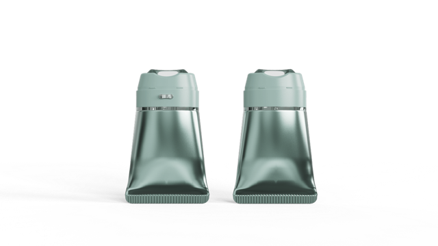 Nuon Medical pousse la formule dans l’applicateur 2 site-industries-cosmetiques Deux récipients en plastique vert métallisé identiques de la marque Nuon Medical, dotés d'une base plate et d'un couvercle à vis, sont disposés côte à côte sur un fond blanc uni, ce qui suggère qu'ils sont destinés à servir d'applicateur médical.